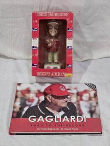lot 22 image: John Gagliardi Bobblehead and Book Set, Including Gagliardi Road to the Record by Frank Rajkowski
