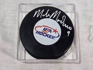 lot 34 image: Autographed Mike Modano USA Hockey Puck in Display Case with Certificate of Authenticity