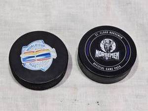 lot 39 image: St. Cloud Norsemen and World Cup of Hockey 2016 Official Game Puck, USA Hockey Logo Puck