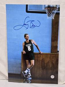 lot 61 image: Larry Bird Autographed Basketball Photo with Authentication Sticker