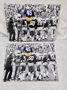 lot 63 image: Lot of 2 Notre Dame Fighting Irish Hoisting Rudy Ruettiger on Their Shoulders Photographs