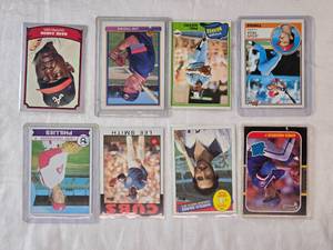 lot 165 image: Lot of 8 Baseball Cards Featuring Greg Maddux Rated Rookie, Harold Baines, Lee Smith, Larry Christenson, Jesus Vega, Phil Niekro, Jim Thome, and Hank Aaron.