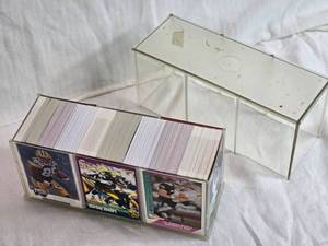 lot 254 image: 8 Plastic Case of Various Brand NFL Football Cards Including from 2008 Upper Deck Football Heroes, Fleer Ultra 91, Score 94, 1991 Pacific - Uncounted