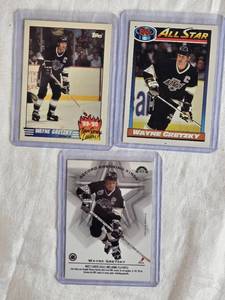 lot 268 image: Lot of 3 Wayne Gretzky Hockey Cards including 1990-91 Topps All-Star and 1989-90 Team Scoring Leaders.