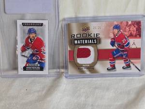 lot 276 image: Lot of 2 Ryan Poehling Rookie Hockey Cards Including Upper Deck Rookie Materials Patch and Chronology Rookie Montreal Canadiens Numbered 23