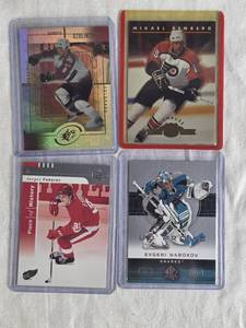 lot 293 image: Lot of 4 Hockey Cards Featuring Mikael Renberg, Evgeni Nabokov, Sandis Ozolinsh, and Sergei Fedorov