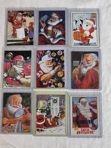 lot 308 image: Lot of 9 Santa Claus Sports Cards Featuring Various Brands and Themes