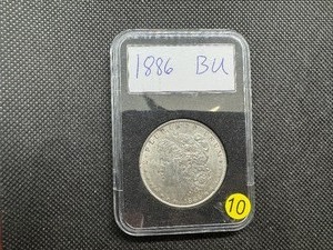 lot 10 image: 1886 Morgan Silver Dollar Marked BU When Purchased