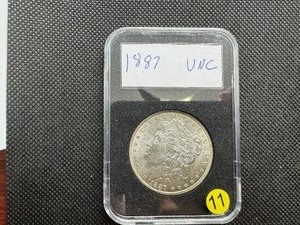 lot 11 image: 1887 Morgan Silver Dollar Marked UNC When Purchased
