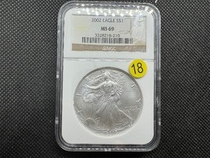 lot 18 image: 2002 1 Oz. Silver American Eagle NGC MS69 - NGC Price Guide is $65