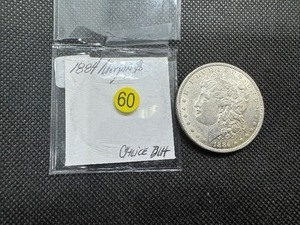 lot 60 image: 1884 Morgan Silver Dollar Marked ChoiceBU When Purchased