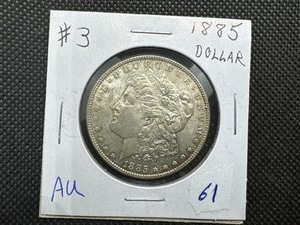 lot 61 image: 1885 Morgan Silver Dollar Marked AU When Purchased