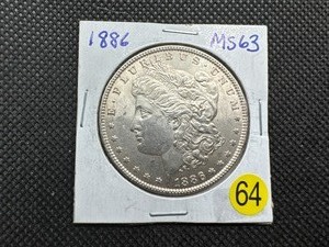 lot 64 image: 1886 Morgan Silver Dollar Marked 63 When Purchased - Nice Mint Luster