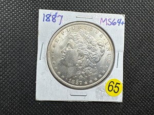 lot 65 image: 1887 Morgan Silver Dollar Marked 64 When Purchased - Nice Mint Luster