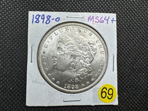 lot 69 image: 1898-O Morgan Silver Dollar Marked 64 When Purchased - Nice Mint Luster