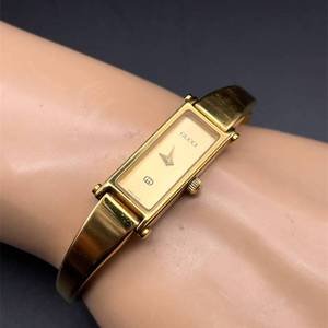 lot 24 image: Vintage Gucci 3900L Gold-Tone Bangle Womens Watch VIDEO