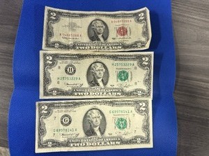 lot 46 image: Three $2.00 Bills 1963 Red Note and two 1976 Notes