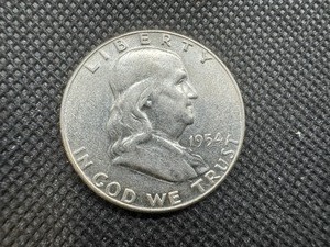 lot 79 image: 1954 AU Silver Franklin Dollar