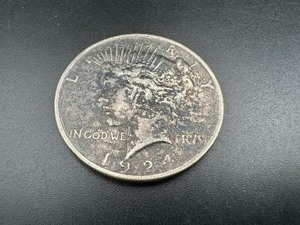 lot 57 image: 1924 Peace Silver Dollar