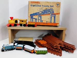 lot 91 image: Lionel Toy Train Pieces - Trestle Set and Mattel Wooden Putt Putt Train