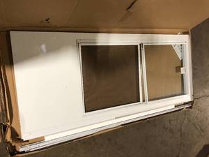lot 25 image: EMCO 34 in. x 80 in. White Universal 34-Light Vinyl Storm Door with Black Hardware Damaged  Customer Returns See Pictures