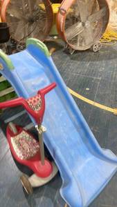 lot 70 image: Childrens Plastic Slide and  Radio Flyer Three-Wheel Scooter