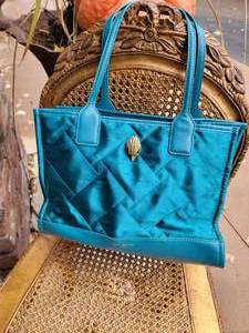 lot 49 image: Kurt Keiger London Teal Quilted Bird Head Handbag Purse, as