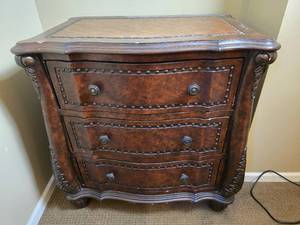 lot 24 image: Elegant Carved Chest of Drawers with Leather Surface Inlay