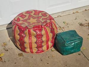 lot 62 image: Moroccan Leather Poof Ottoman Pairing
