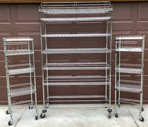 lot 62 image: 3 HDX Metal Shelving Units on Wheels