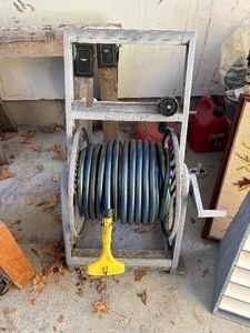 lot 123 image: Garden Hose and Reel