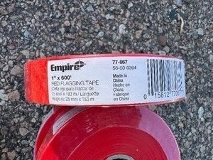 lot 115 image: Empire Red Flagging Tape 1 x 600. Four Rolls.