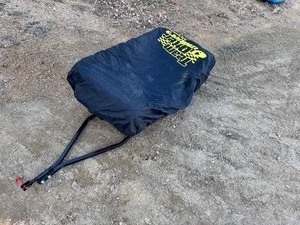 lot 19 image: Otter II Den Flip-Over Portable Ice Fish House. Includes cover, plastic sled and tow bar.