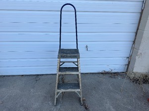 lot 23 image: Louisville Three Step Ladder with Wheels and Handle 300 lb Capacity