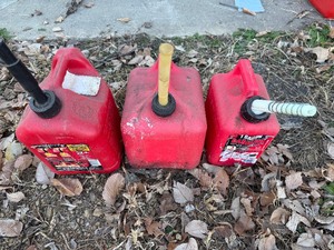 lot 25 image: Three Gas Cans - 1 Gallon, 2 Gallon and 2 Gallon Cans
