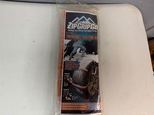 lot 69 image: Emergency Traction Aid. ZipGripGo. One Size Fits Most Cars, Vans and Light Trucks.