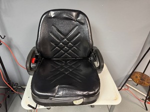 lot 80 image: Forklift Seat. Adjustable, Seat Belt, Arm Rest, Back Storage Area. In very good condition