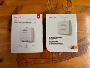 lot 145 image: Two Honeywell Non-Programmable Thermostats