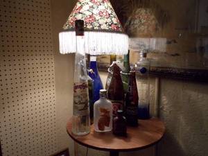 lot 110 image: Old bottles and lamp