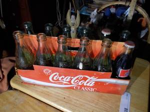 lot 361 image: vintage collectible pack of Coca-Cola glass bottles in their original cardboard carrier.