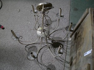 lot 394 image: This is a six-arm wrought iron candle chandelier