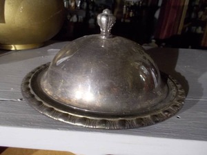 This is a vintage silver-plated lidded butter dish with a glass insert