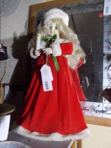lot 223 image: a vintage animated Christmas girl doll with a candle,