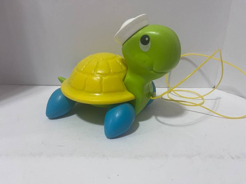 lot 43 image: 1977 Fisher Price Plastic Tag Along Turtle Pull Toy