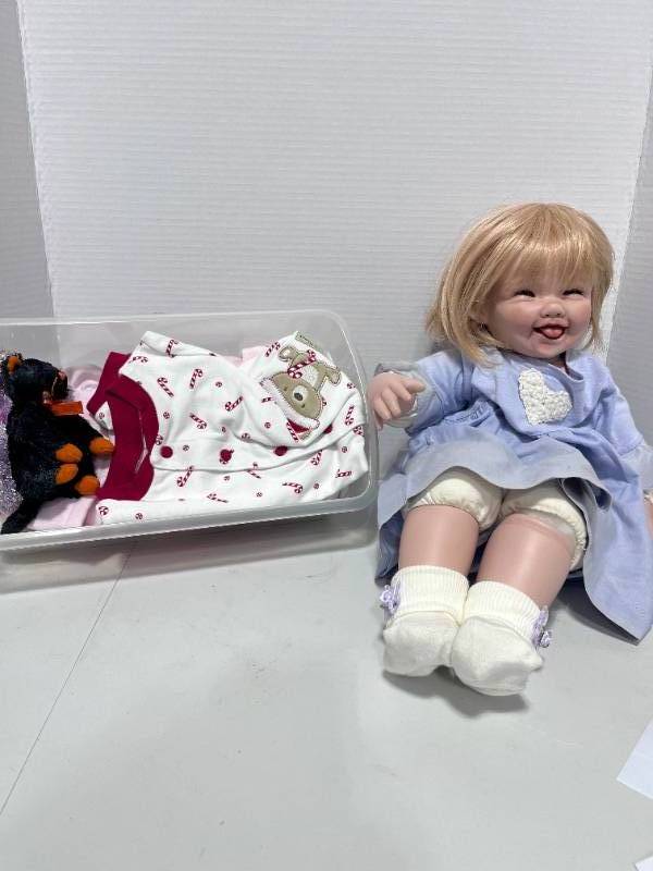 lot 121 image: Jointed Bendable Porcelain Doll with Extra Outfits