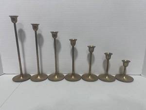 lot 81 image: 7 Graduated Brass Candle Sticks