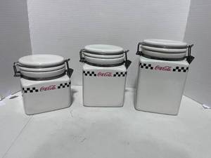 lot 144 image: Coca Cola Canister Set