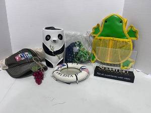lot 145 image: Lot of Misc. Eagles Neck Warmer, Panda Cub, Picture Frame and More