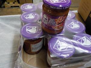 lot 246 image: 12 jars Taco Bell Pizza Dip...