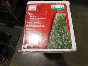 lot 208 image: Home Accents Holiday 6.5 ft. Festive Pine LED Pre-Lit Artificial Christmas Tree T9